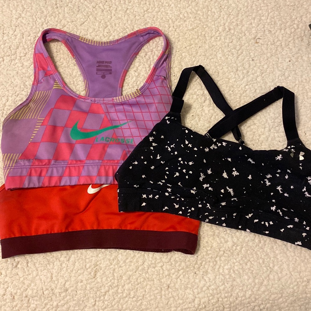 2 nike sports bras and 1 under armor sports bra
